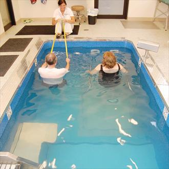 Two people doing Pool therapy in HydroWorx Pool