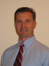 Professional headshot of person in a tie