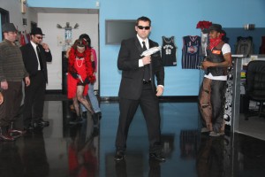 Person in suit dancing with others in the background