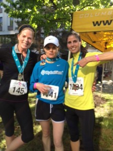 Three runners posing for a photo