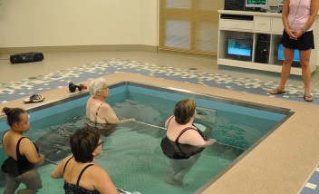 Group water therapy with trainer
