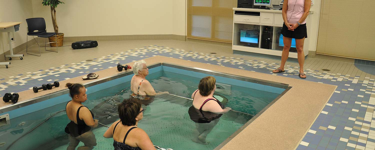 Group water therapy with trainer