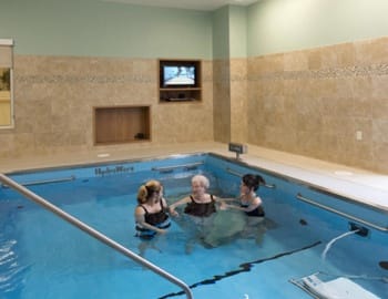 Two People training in therapy pool