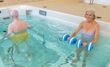 Two people training together in HydroWorx Pool