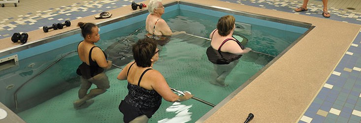 Group water therapy with trainer