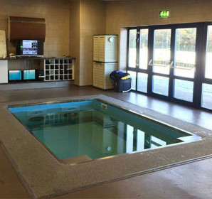 Indoor HydroWorx pool by building exit