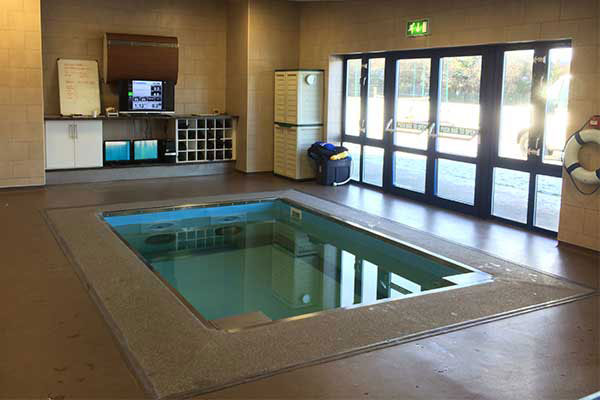 Indoor HydroWorx pool by building exit