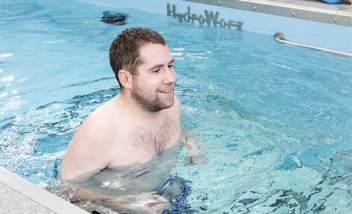 Person smiling and running in HydroWorx Pool