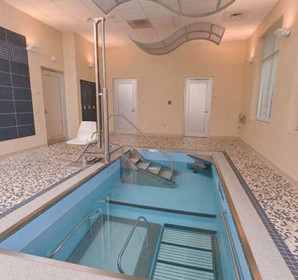 Floor to ceiling view of indoor HydroWorx pool area