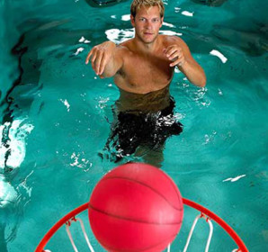 Person shooting basketball from HydroWorx pool