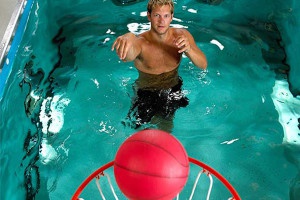 Person shooting basketball from HydroWorx pool
