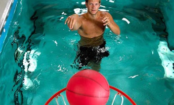 Person shooting basketball from HydroWorx pool