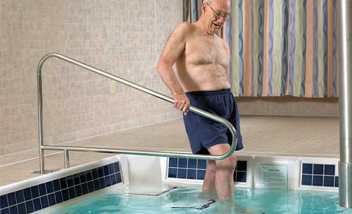 Person stepping into pool