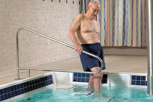 Person stepping into pool