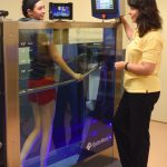 woman talking to trainer while in hydroworx 350