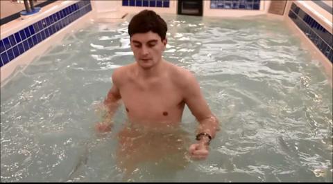 man doing exercises in pool