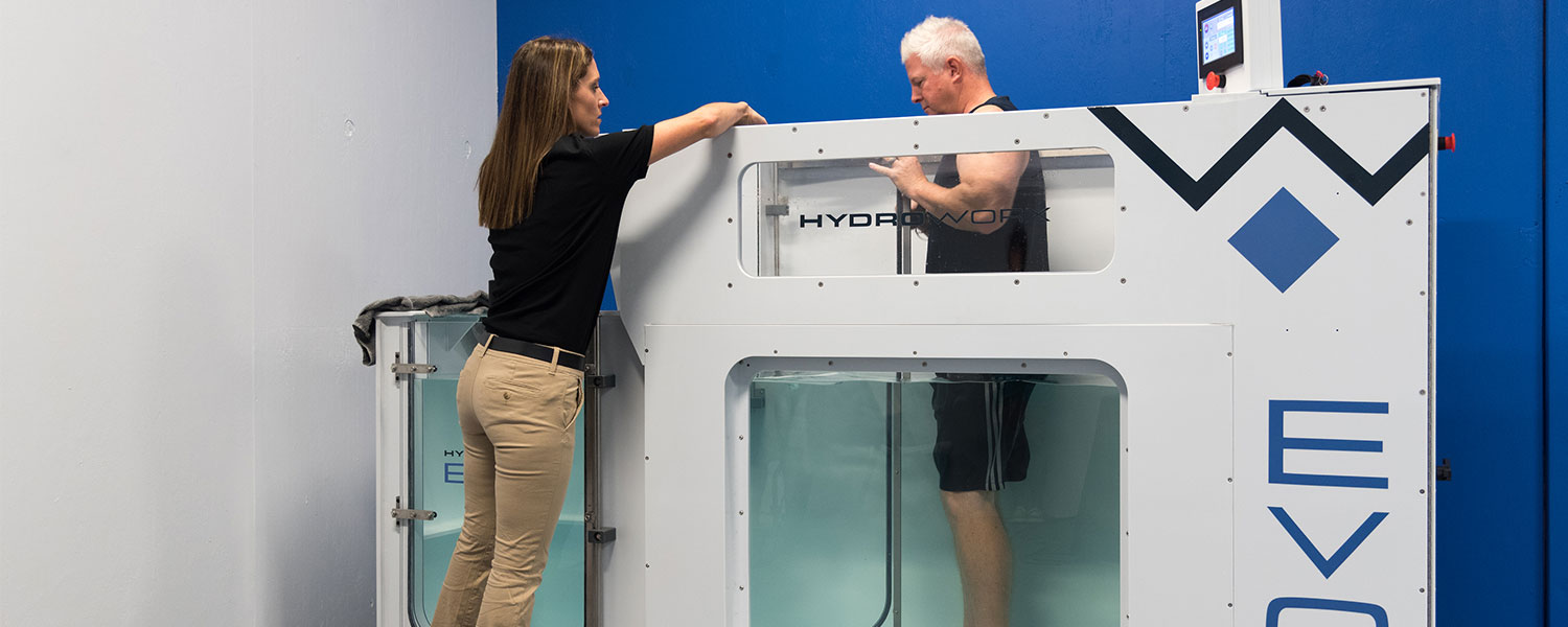 man training in hydroworx evo with trainer