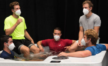 group of young men wearing masks using THRIVE Plunge