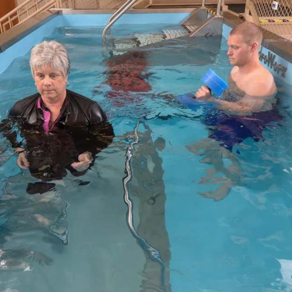 older woman and a man in a HydroWorx pool