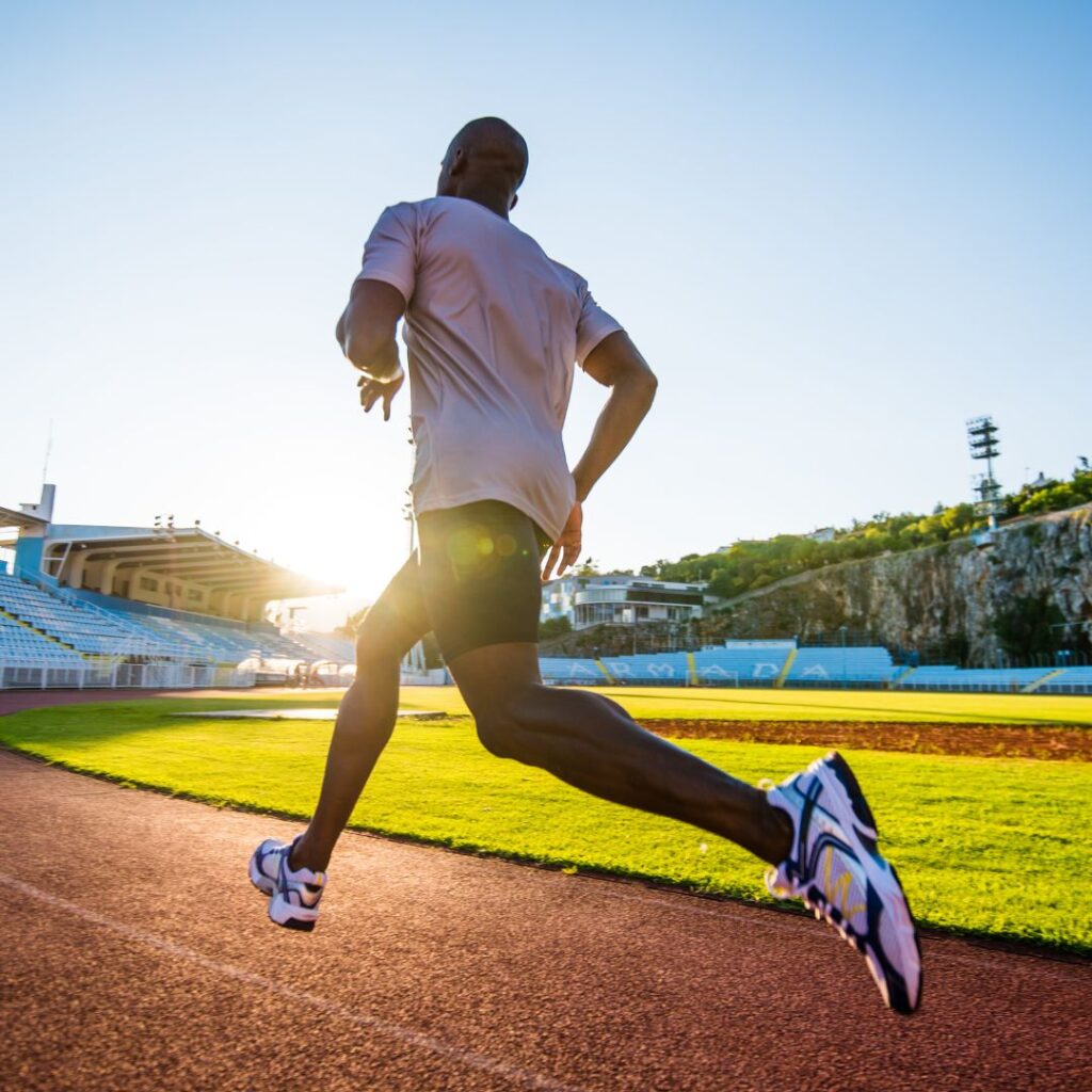 athlete running on a track