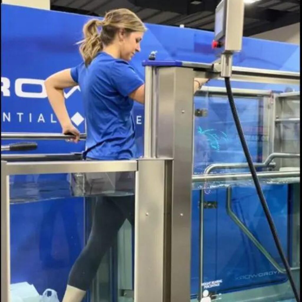 woman demonstrating HydroWorx pool